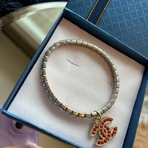 Luxury charm in unbranded stretchy rhinestone bracelet